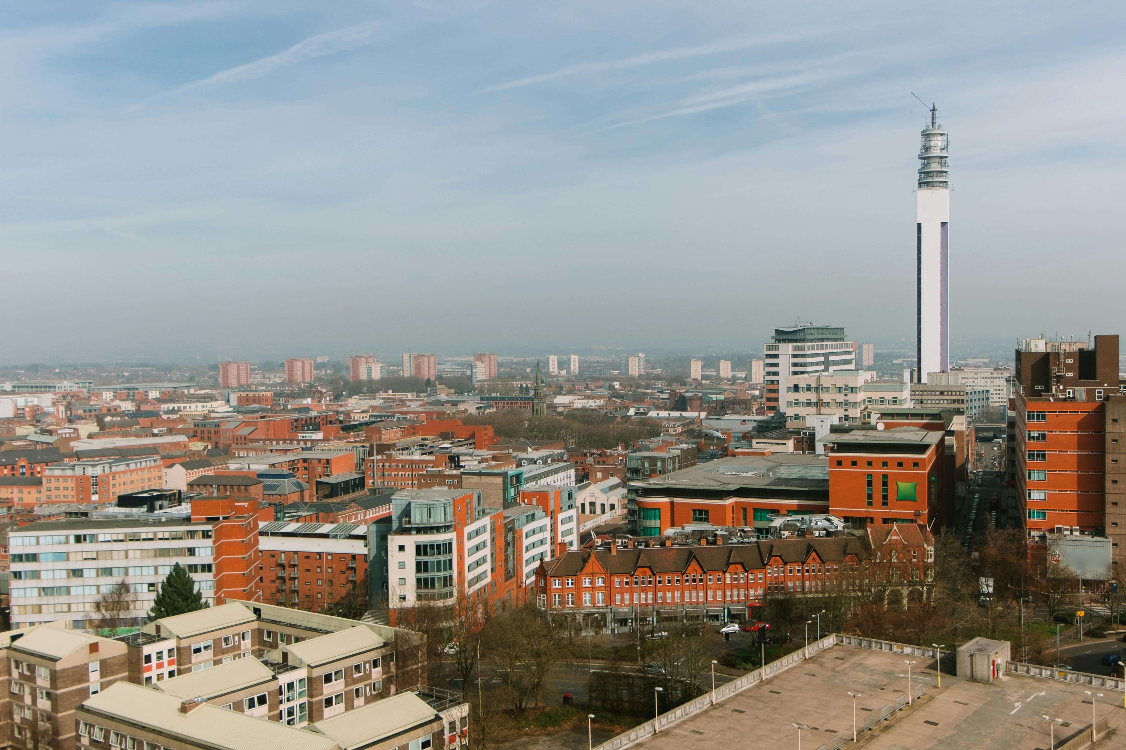 Birmingham city skyline with BT Tower rising above rooftops and urban landscape