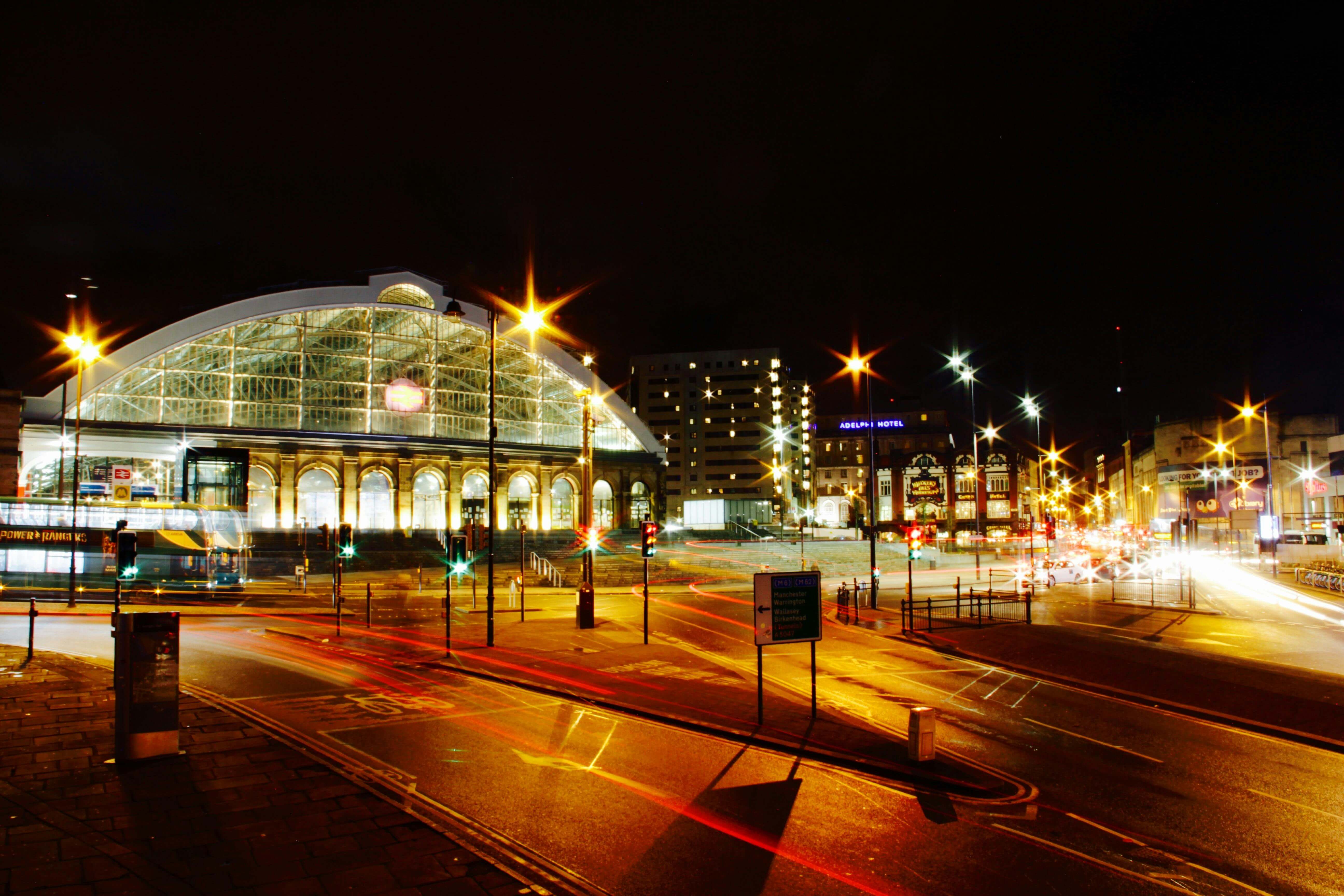Liverpool Lime Street station's illuminated Victorian train shed at night