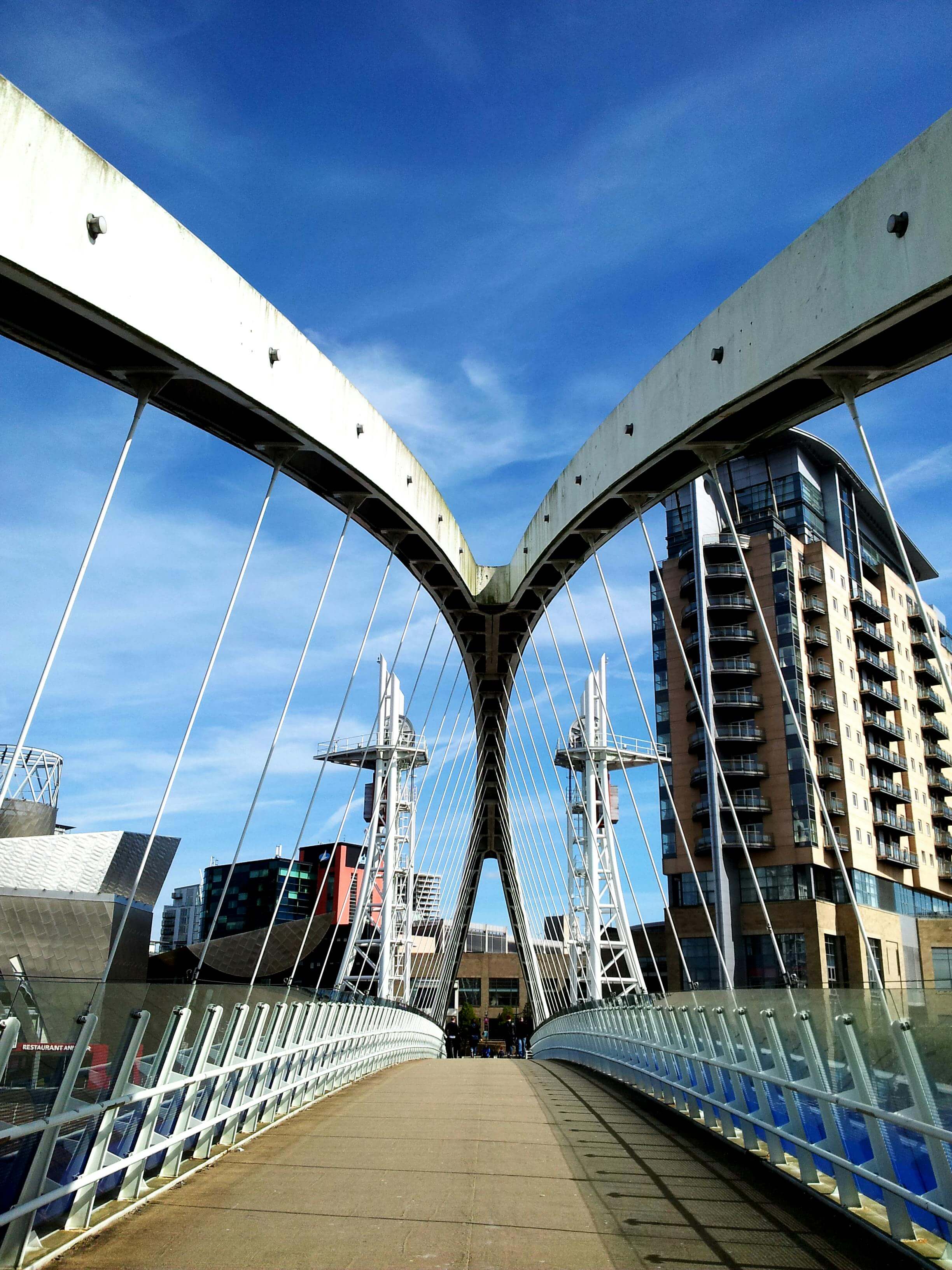 Merchant's Bridge modern footbridge crossing the canal in Manchester