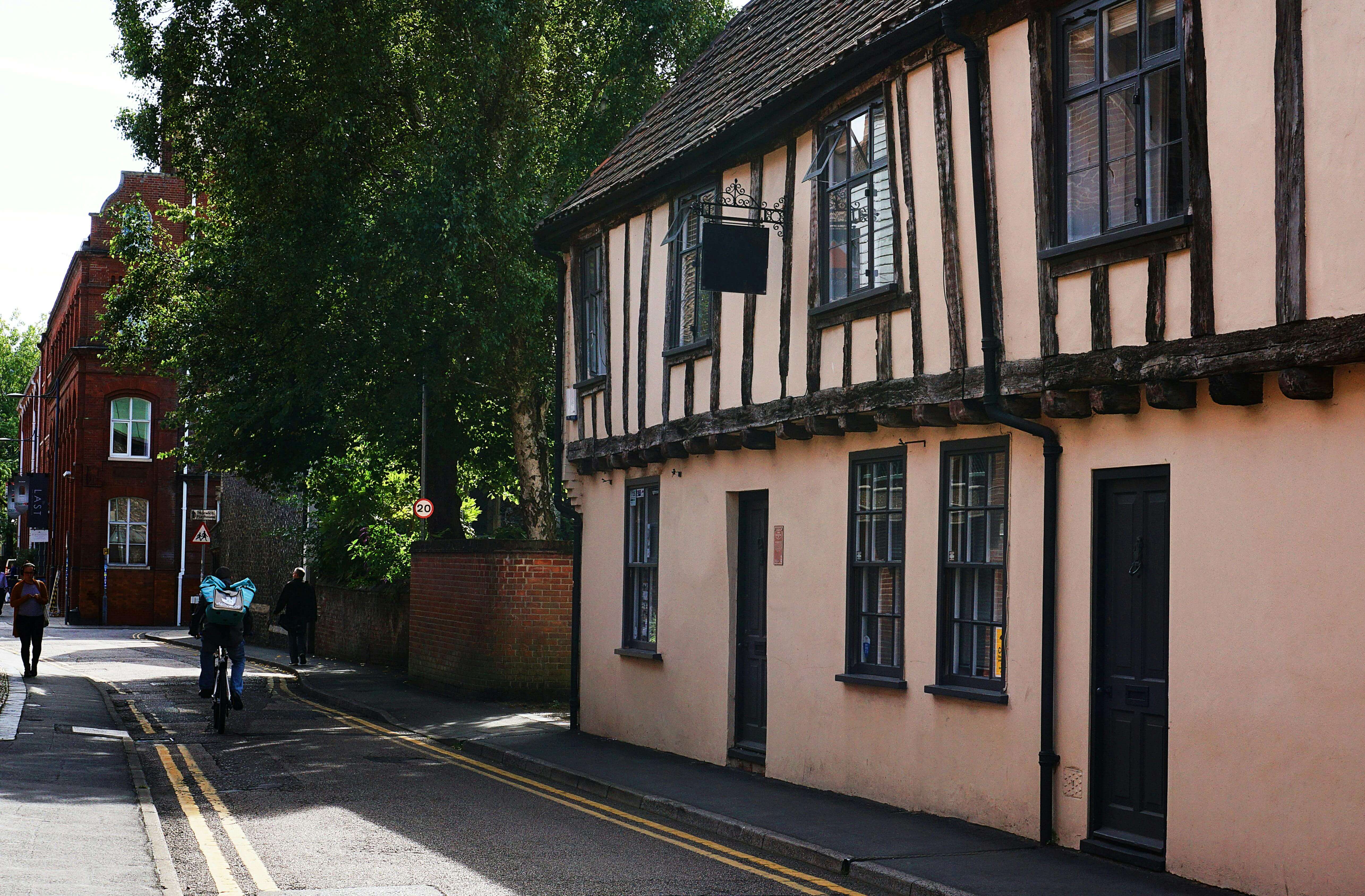 Medieval timber-framed building on quiet street in Norwich